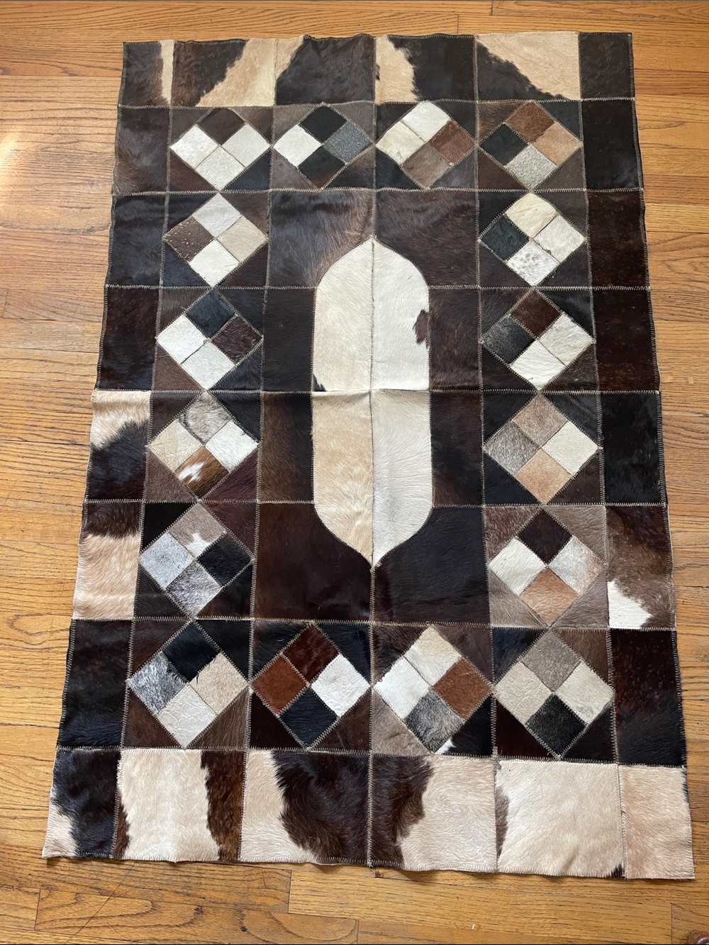 NEW Handcrafted Brown , Black, tan and White Patchwork Cowhide Accent Rug